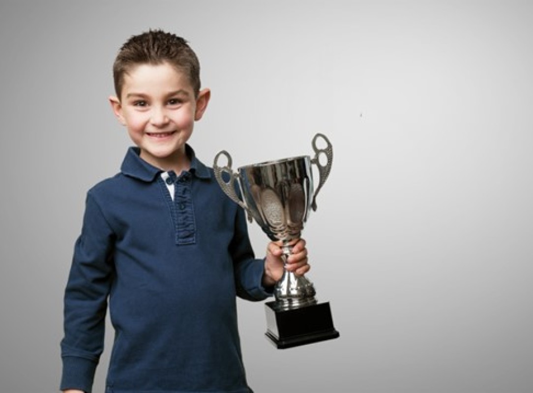 Child holding a trophy | Best Playschool near me