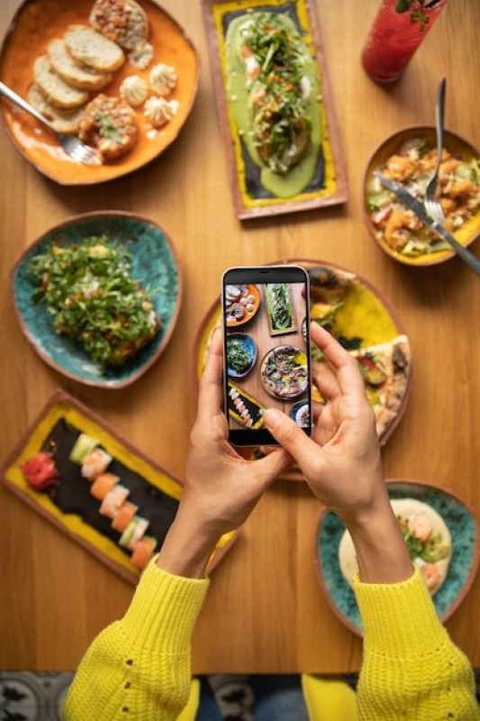 Camera taking photo of delicious meals